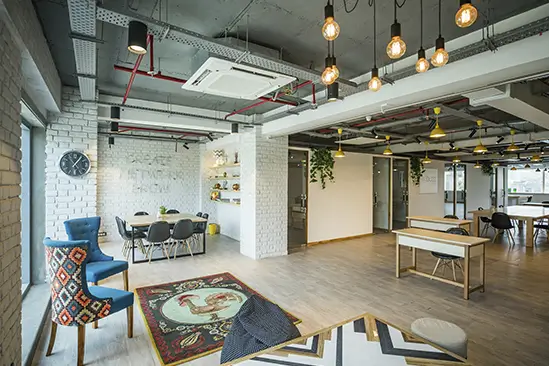 Commercial Renovation in Barcelona for a modern open-plan office with bright coworking space, meeting areas and contemporary décor